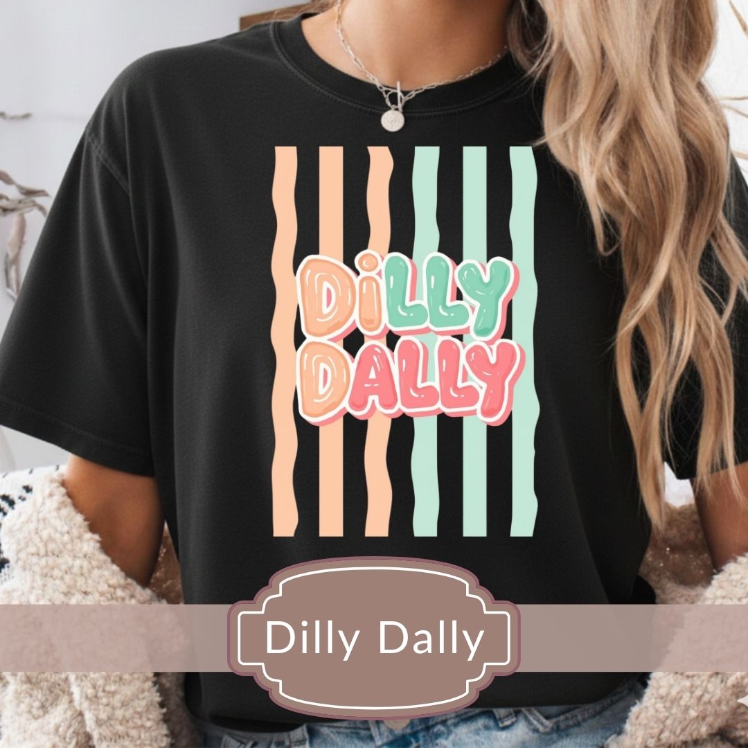 Black t-shirt with 'Dilly Dally' graphic design worn by a person.
