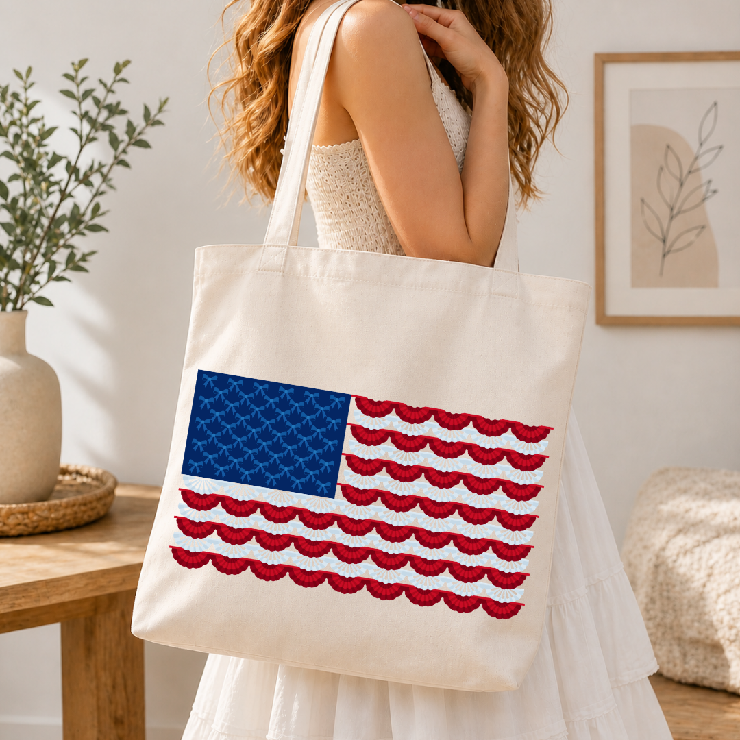 Person holding a tote bag with an American flag design in a home setting