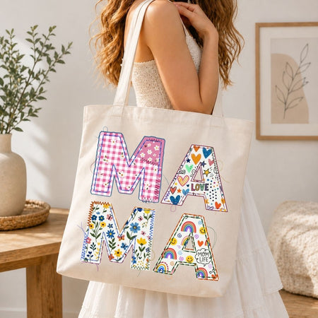 Tote bag with colorful letters spelling 'MAMA' held by a person in a home setting.