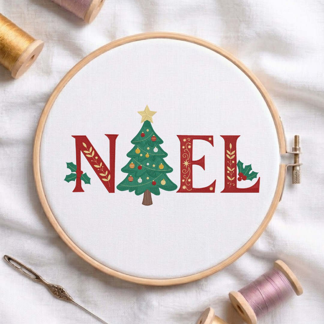 "NOEL" Christmas lettering design featuring red serif letters decorated with golden leafy vines and holly leaves, with a decorated Christmas tree replacing the letter O, shown in a wooden embroidery hoop on white fabric with thread spools and a needle