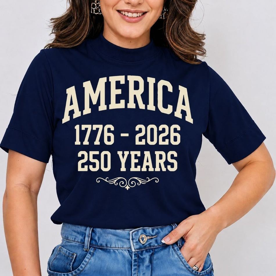Person wearing a navy blue t-shirt with 'AMERICA 1776 - 2026 250 YEARS' text on a plain background