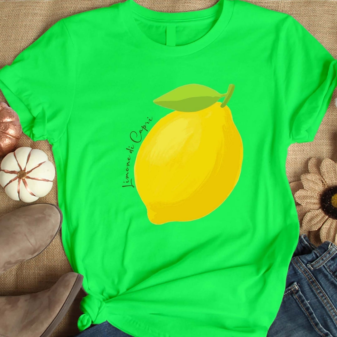 Green t-shirt with a lemon graphic on a textured surface