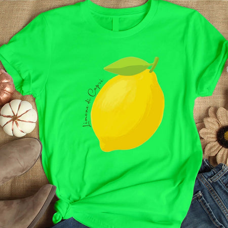 Green t-shirt with a lemon graphic on a textured surface