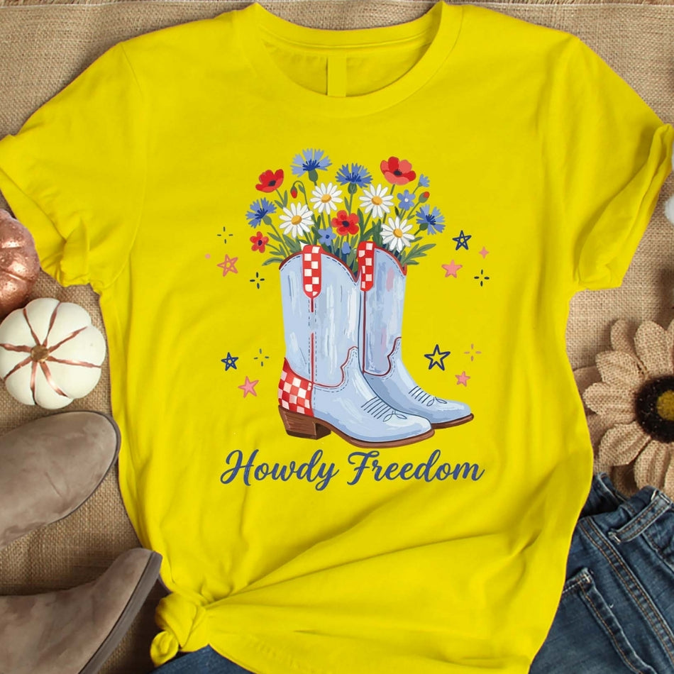 Yellow t-shirt with blue cowboy boots and flowers design on a textured surface
