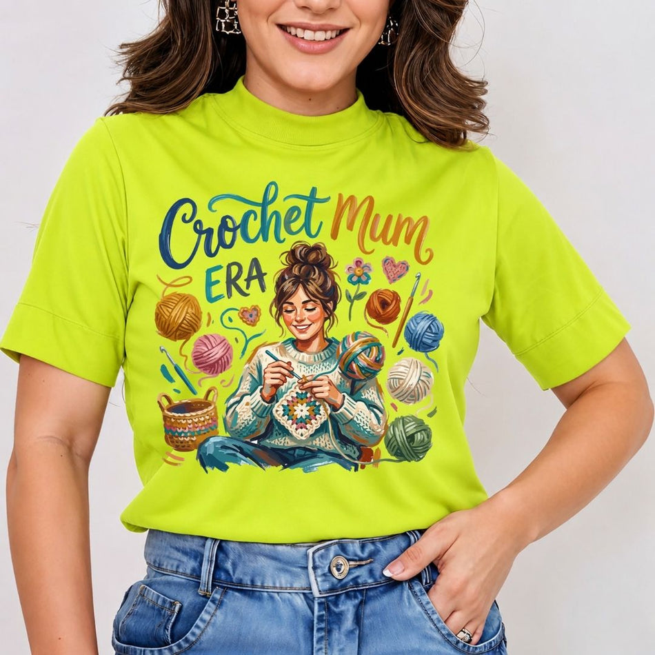 Person wearing a bright green t-shirt with a 'Crochet Mum Era' design.