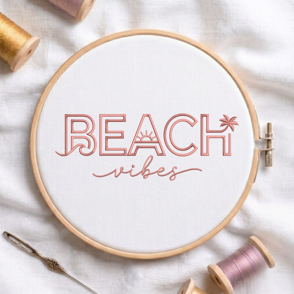 The "Beach Vibes" embroidery design centered in a wooden embroidery hoop, surrounded by embroidery thread spools and a needle.