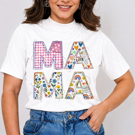 Person wearing a white t-shirt with colorful 'MAMA' design on a plain background