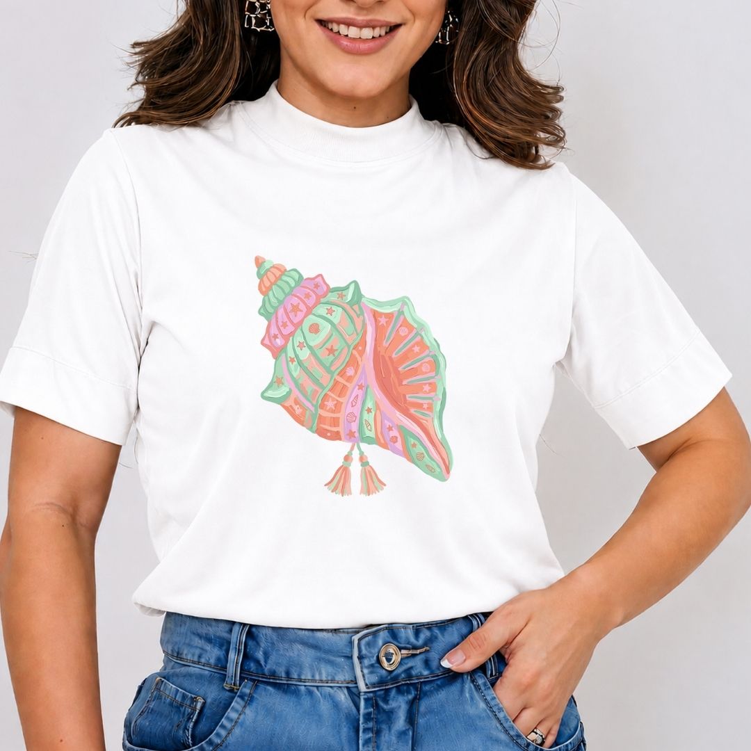 Person wearing a white t-shirt with a colorful shell design on a plain background