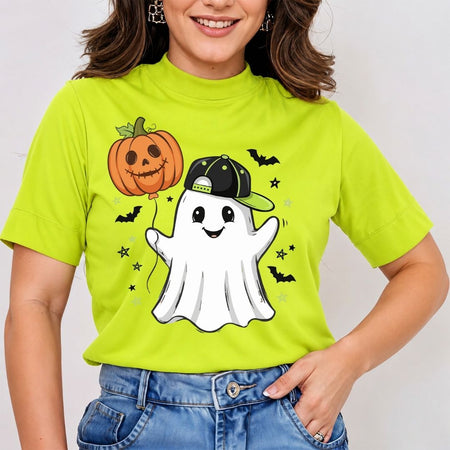 A woman wearing a bright lime green short-sleeve t-shirt with a cartoon Halloween graphic of a white ghost holding an orange jack-o'-lantern balloon, set against a plain light gray background.