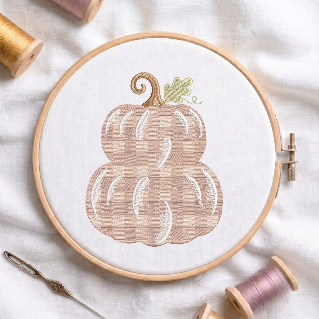 The "Bee Happy" embroidery design centered in a wooden embroidery hoop, surrounded by embroidery thread spools and a needle.