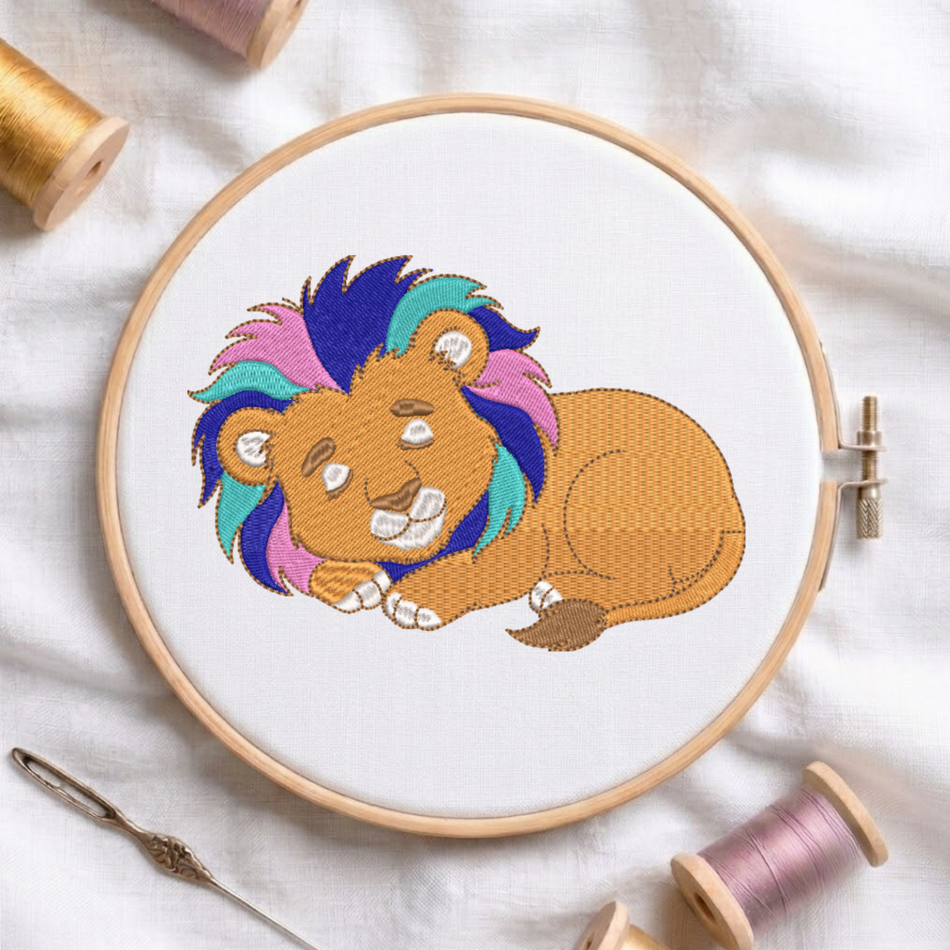 Embroidery hoop with a colorful lion design on a white fabric background.