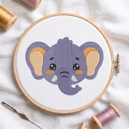 Embroidery hoop with a completed purple elephant design on a white fabric background.