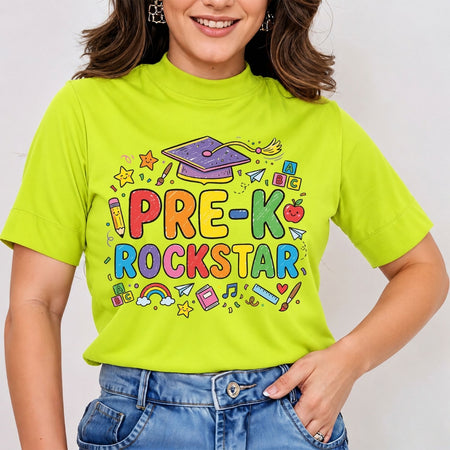 A woman wearing a bright lime green mock-neck t-shirt with a colorful 'PRE-K ROCKSTAR' graphic print on the front, paired with blue jeans.