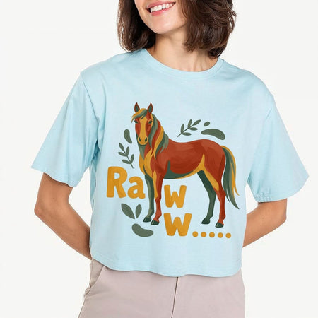 A woman modeling a light pastel blue crop top t-shirt featuring a large brown and green watercolor horse illustration with the text "Raww...".