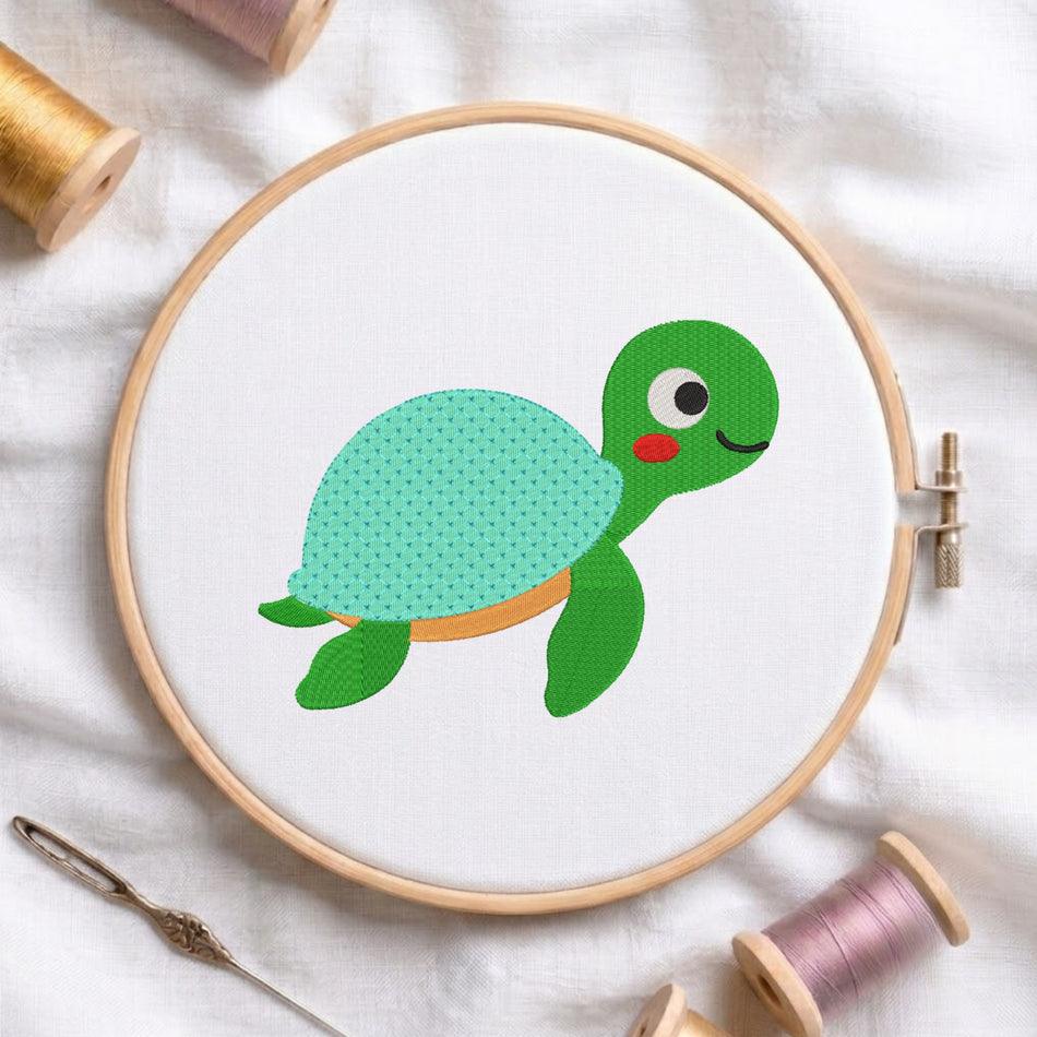 A wooden embroidery hoop holds white fabric with a cartoon turtle design in green and mint, surrounded by spools of thread and a needle on a white fabric background.