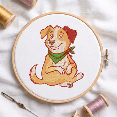 An embroidered design of a smiling dog wearing a green bandana displayed inside a wooden embroidery hoop, surrounded by sewing tools and thread.
