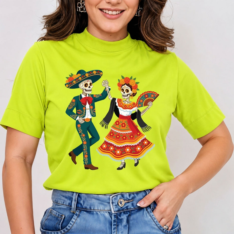 A woman wearing a bright lime green short-sleeve t-shirt with a colorful Day of the Dead skeleton dancing graphic, paired with blue jeans.
