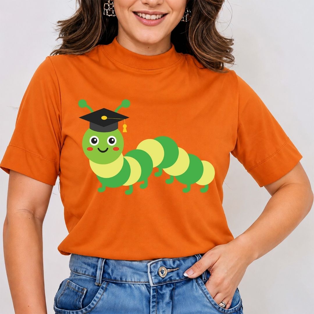 Person wearing an orange t-shirt with a green caterpillar graphic and graduation cap.