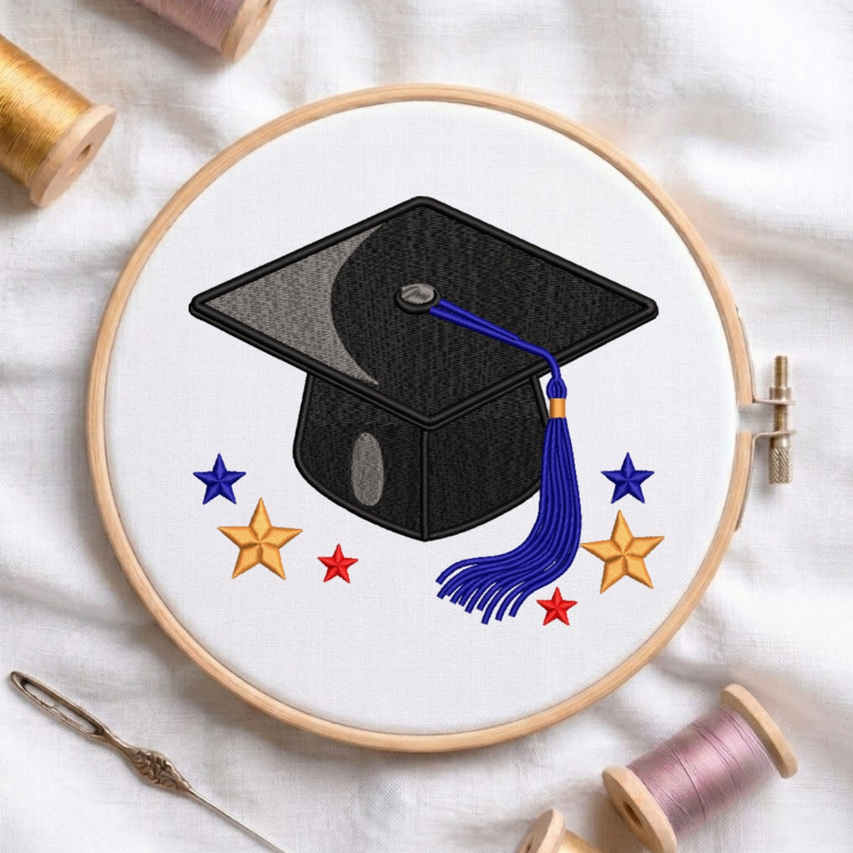 Embroidery hoop with a graduation cap design on a white fabric background