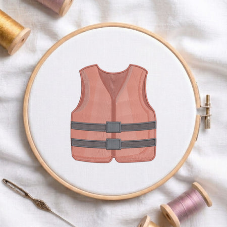 Life jacket safety vest machine embroidery design framed inside a round wooden hoop with thread spools.