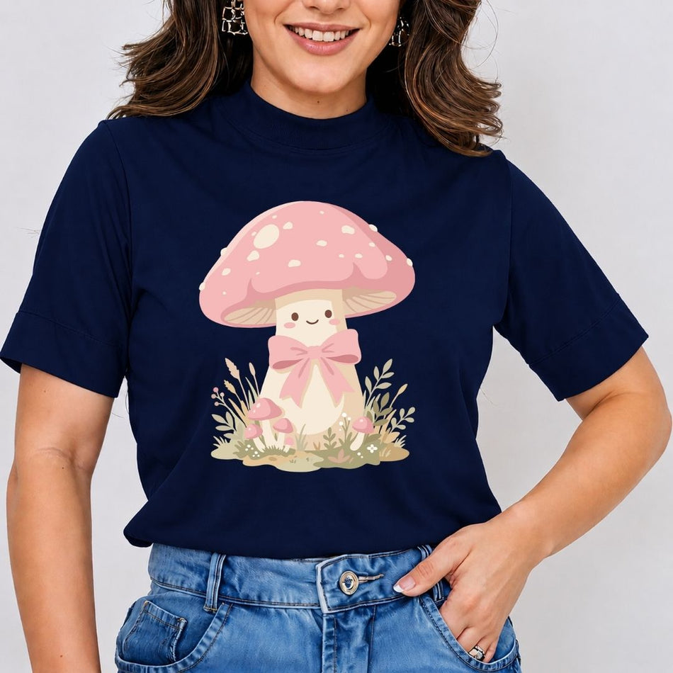 Person wearing a navy blue t-shirt with a pink mushroom design on a plain background