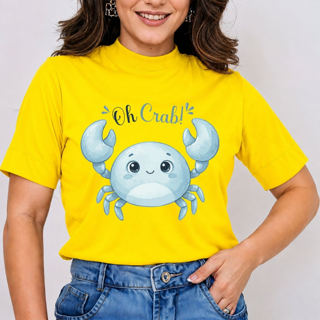 A person wearing a bright yellow t-shirt with a blue cartoon crab graphic and the text "Oh Crab!" printed on the front.