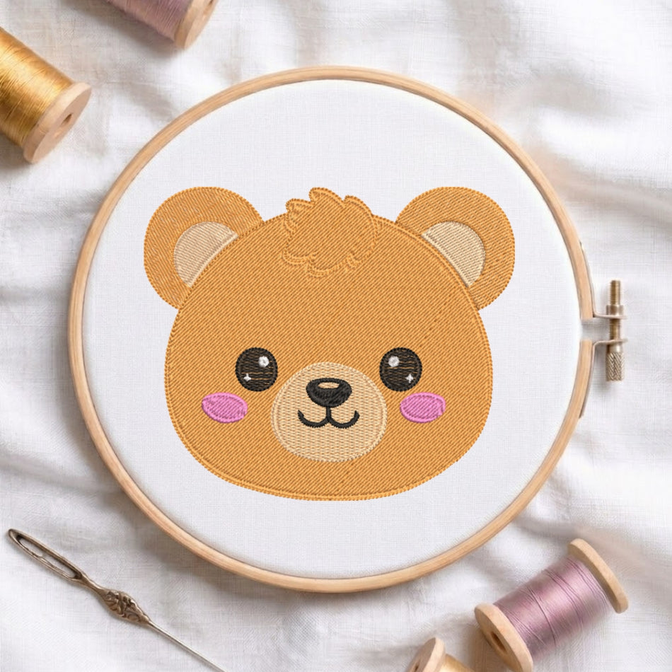 Embroidery hoop with a teddy bear design on a white fabric background