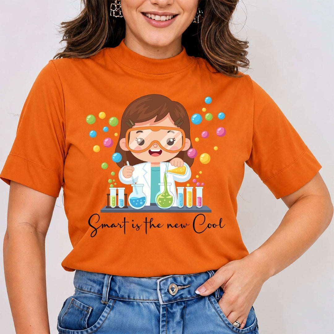 A person wearing a white t-shirt featuring a girl scientist graphic and the text "Smart is the new Cool."