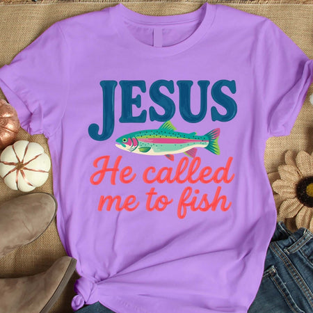 Purple t-shirt with 'Jesus He called me to fish' text and fish graphic on a textured surface.