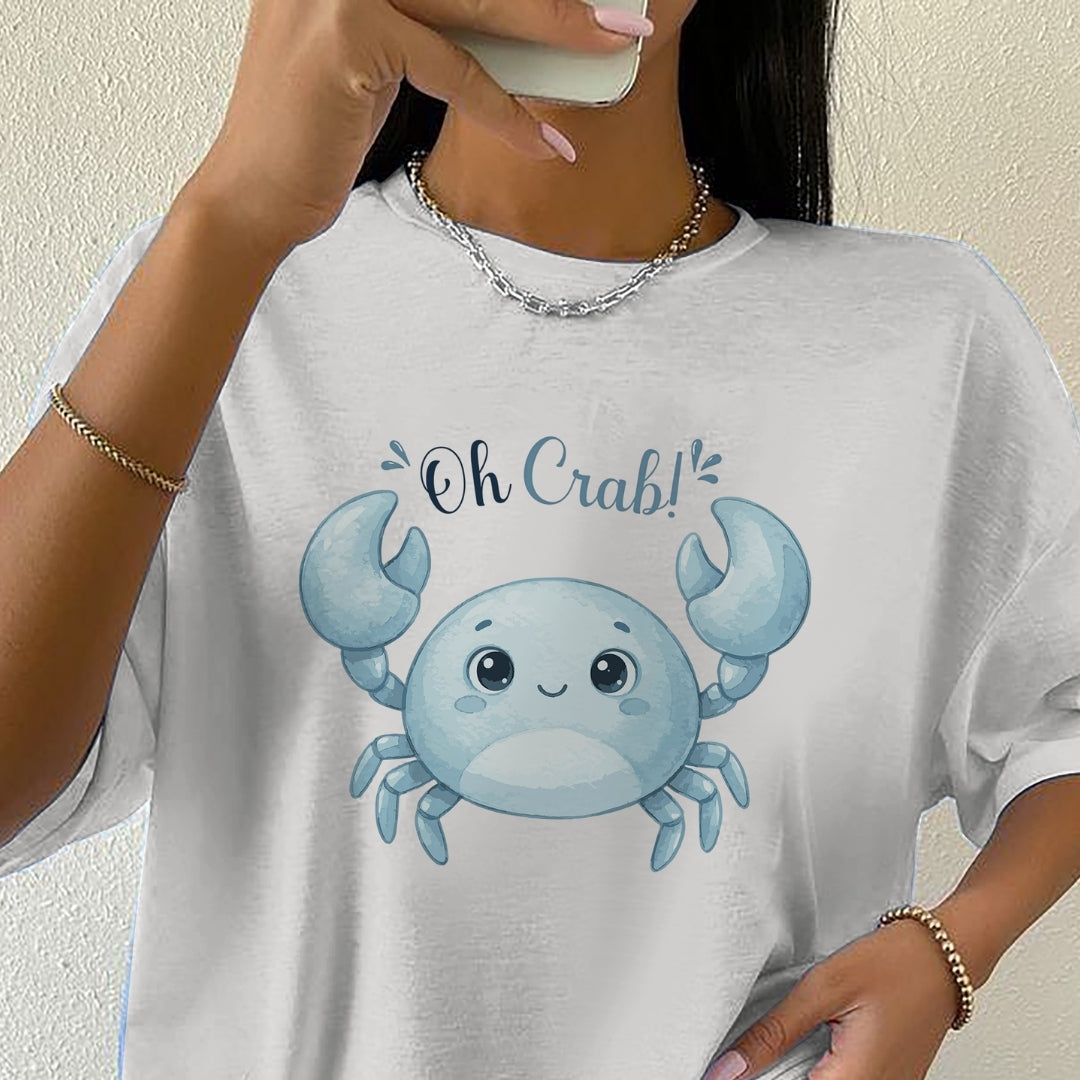 Person wearing a white t-shirt with a blue crab graphic and 'Oh Crab!' text.