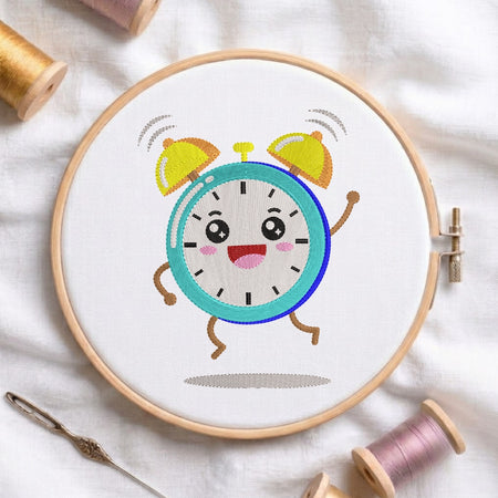 Embroidery hoop with a cartoon clock design on a white fabric background