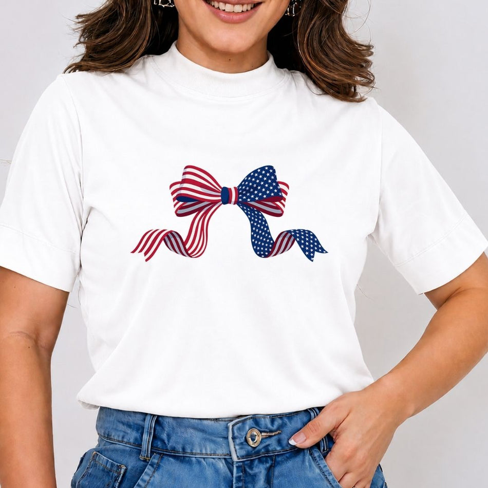Person wearing a white t-shirt with a design of two bows, one red, white, and blue, and the other blue and white, on a plain background.
