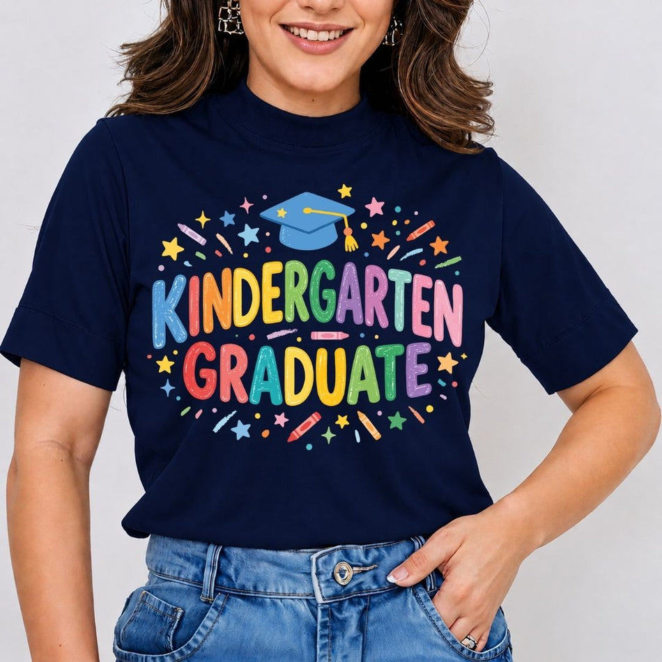 Person wearing a navy blue t-shirt with 'Kindergarten Graduate' in colorful letters on a plain background