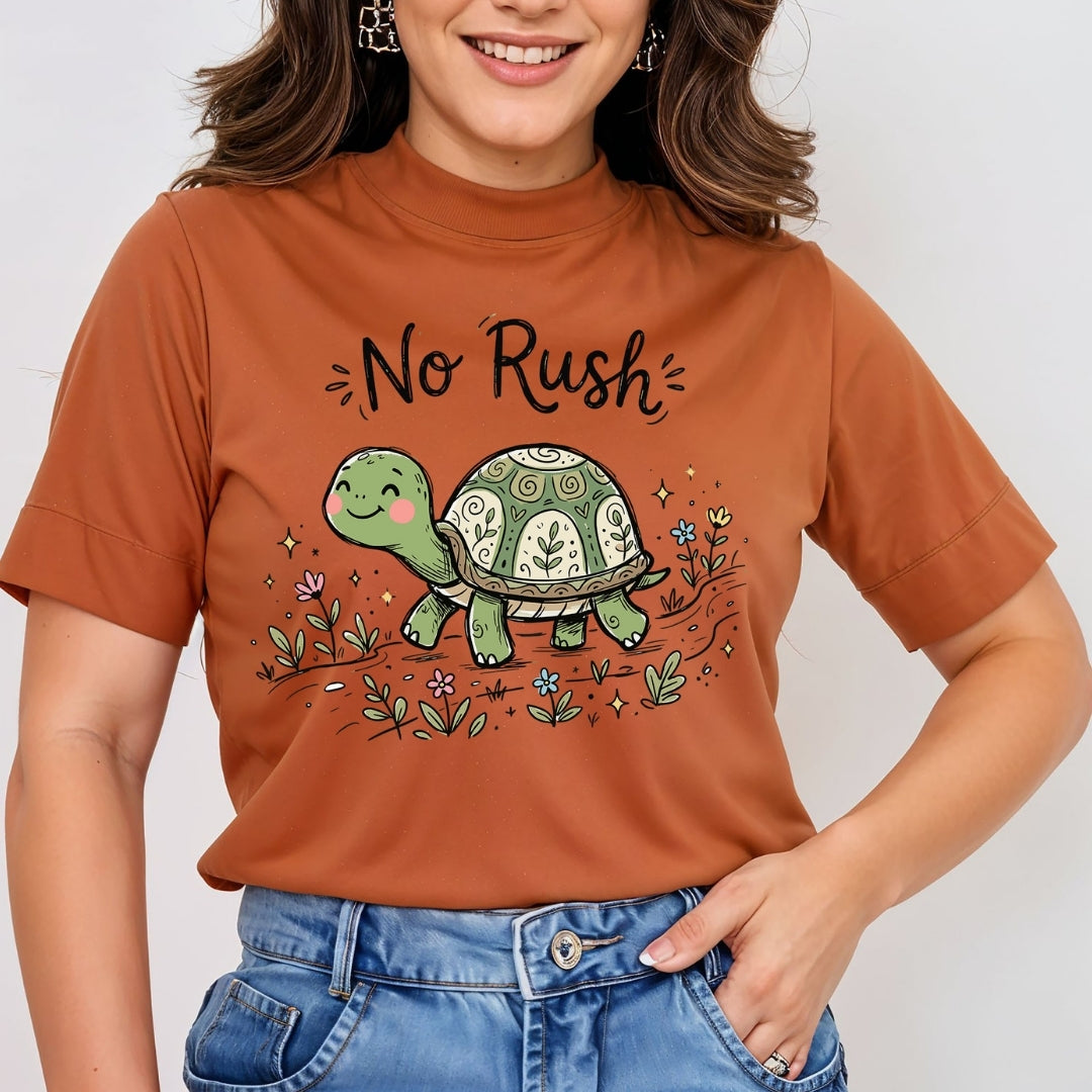 Smiling person wearing a rust-orange t-shirt featuring the cute "No Rush" turtle graphic and typography.