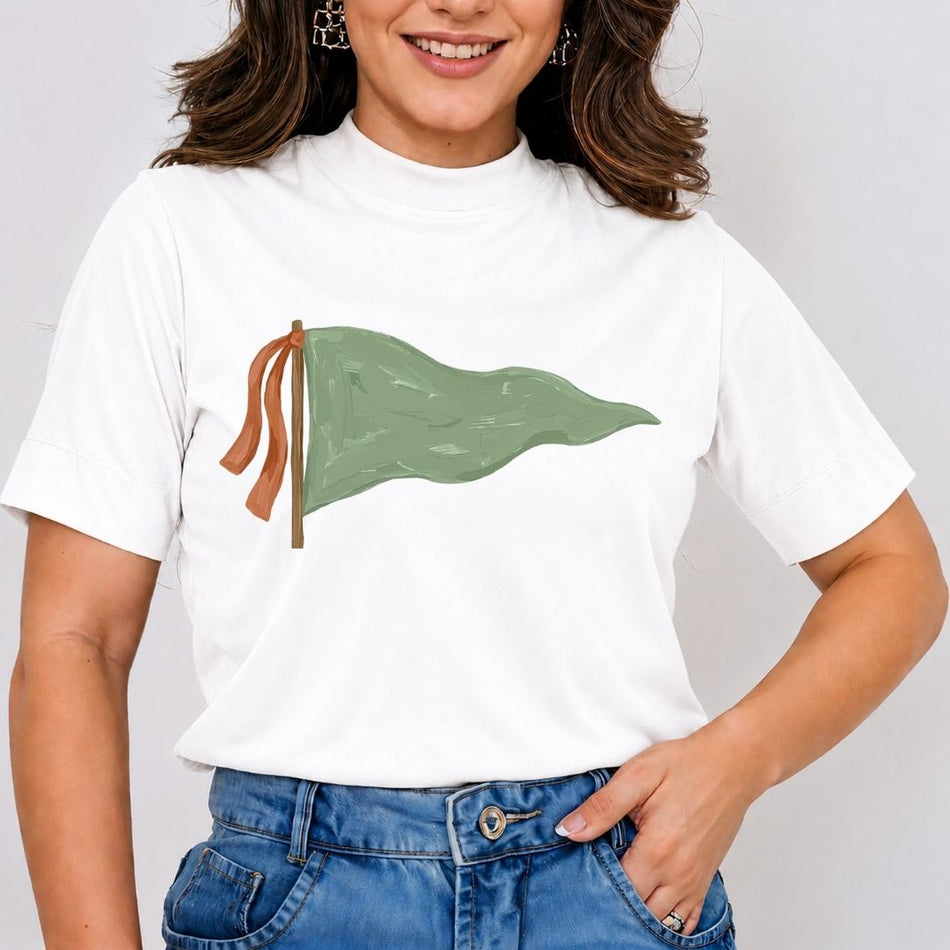 Person wearing a white t-shirt with a green flag design on a plain background