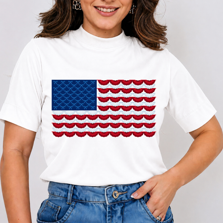 Person wearing a white t-shirt with a red, white, and blue flag design on a plain background