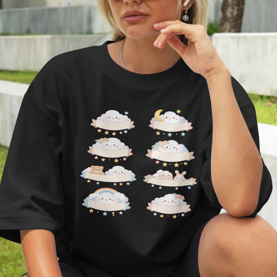 Person wearing a black t-shirt with cloud designs outdoors