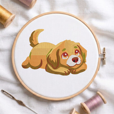 Embroidery hoop with a completed cross-stitch of a dog, surrounded by spools of thread on a white fabric background.