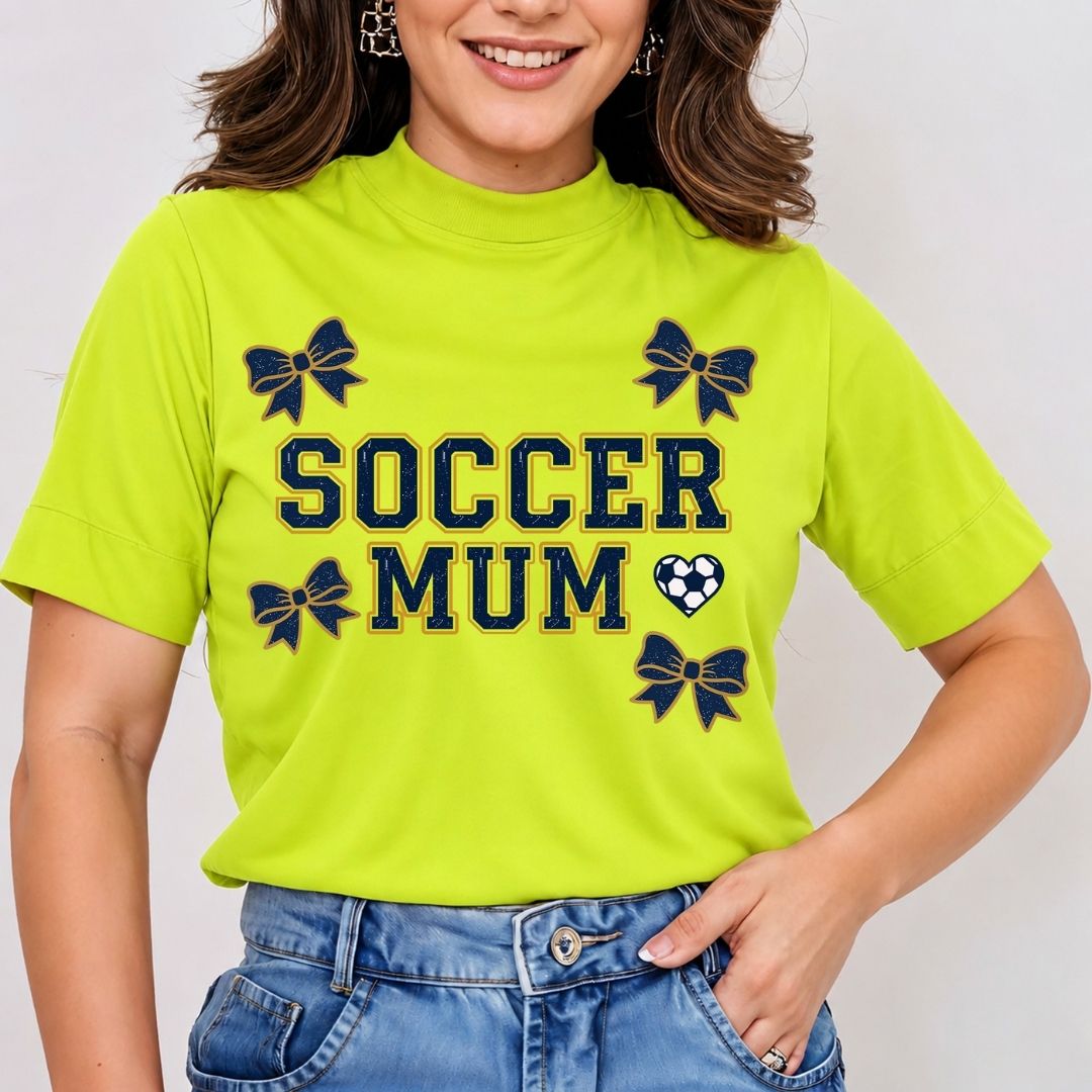 Person wearing a bright green t-shirt with 'Soccer Mum' text and bow designs.