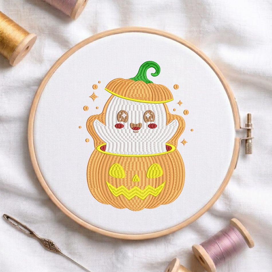 A circular embroidery hoop holding a white fabric base with a stitched cartoon jack-o'-lantern design. The pumpkin has an orange body, yellow stitched details, a green stem, and a white ghostly face peeking out from behind it.
