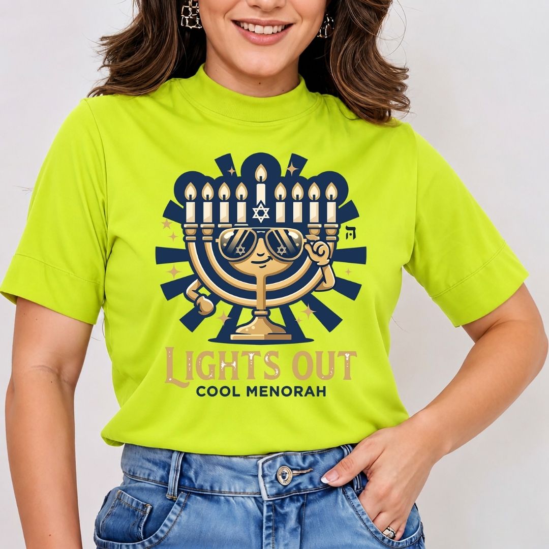 Front view mockup of a woman wearing a lime green t-shirt printed with a cartoon golden Hanukkah menorah wearing sunglasses and giving a peace sign above the text "LIGHTS OUT COOL MENORAH".