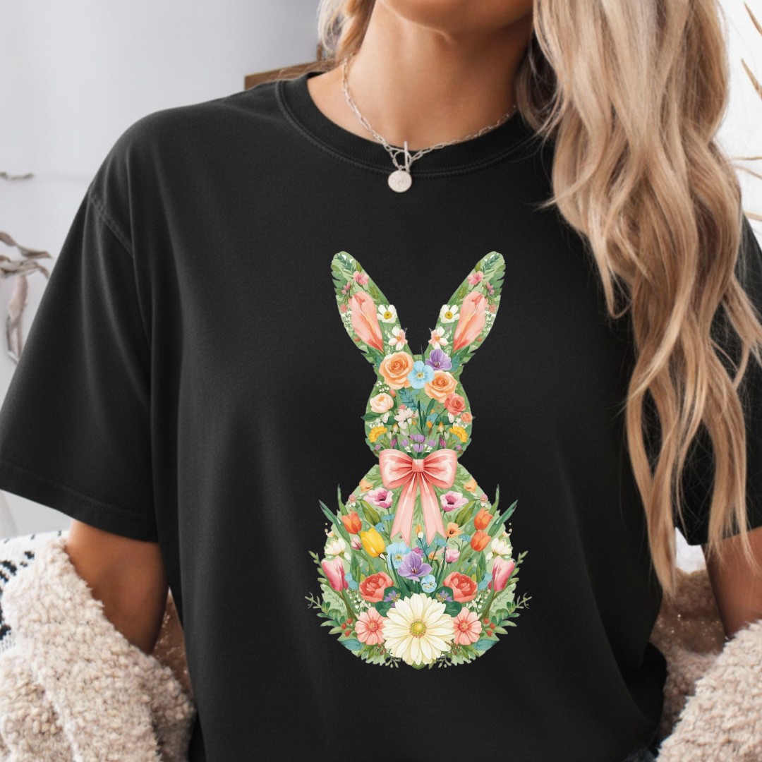Black t-shirt with a floral bunny design worn by a person.