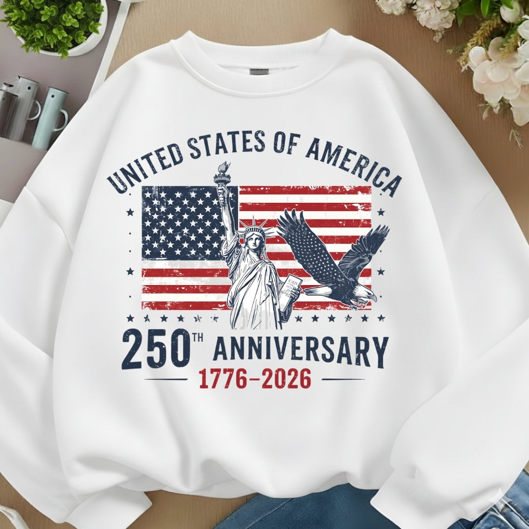 White sweatshirt with American flag and Statue of Liberty design on a neutral background