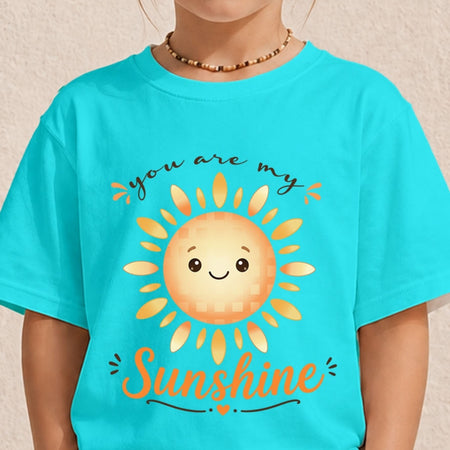 A person wearing a bright turquoise t-shirt featuring a happy cartoon sun graphic and the text "you are my Sunshine".
