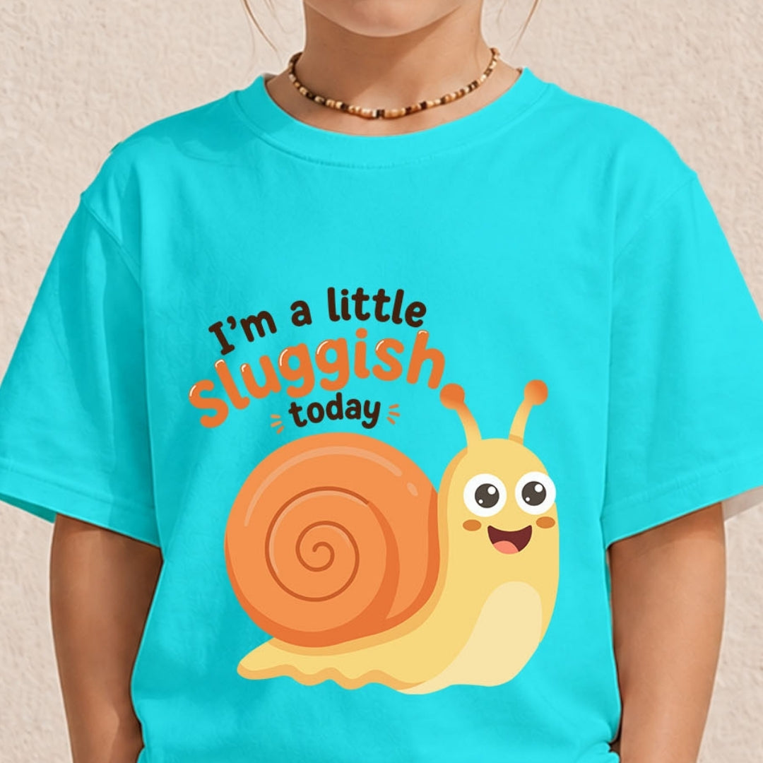 A person wearing a bright turquoise t-shirt featuring a cute, smiling cartoon snail graphic and the text "I’m a little sluggish today."
