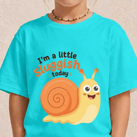 A person wearing a bright turquoise t-shirt featuring a cute, smiling cartoon snail graphic and the text "I’m a little sluggish today."