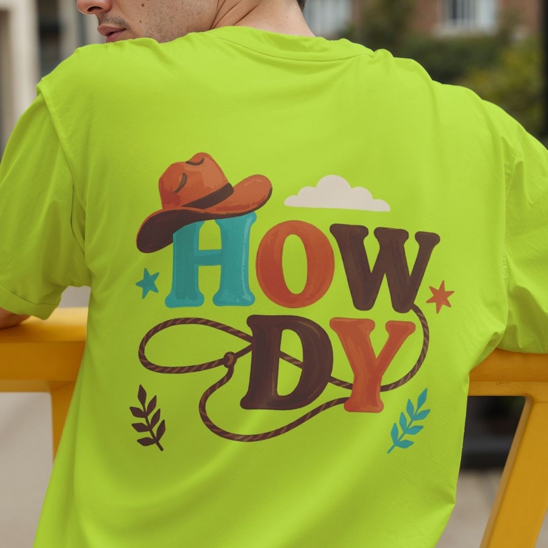 Rear view of a man wearing a bright lime green t-shirt showing a large retro "Howdy" cowboy sublimation print on the back.