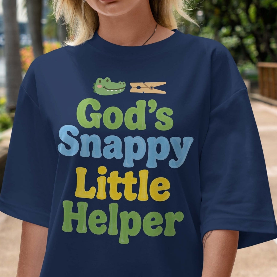 Person wearing a navy blue t-shirt with colorful text and graphic design.