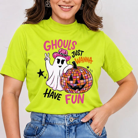 A person wearing a bright lime green high-neck t-shirt and jeans, printed with the Ghouls Just Wanna Have Fun Halloween ghost design.