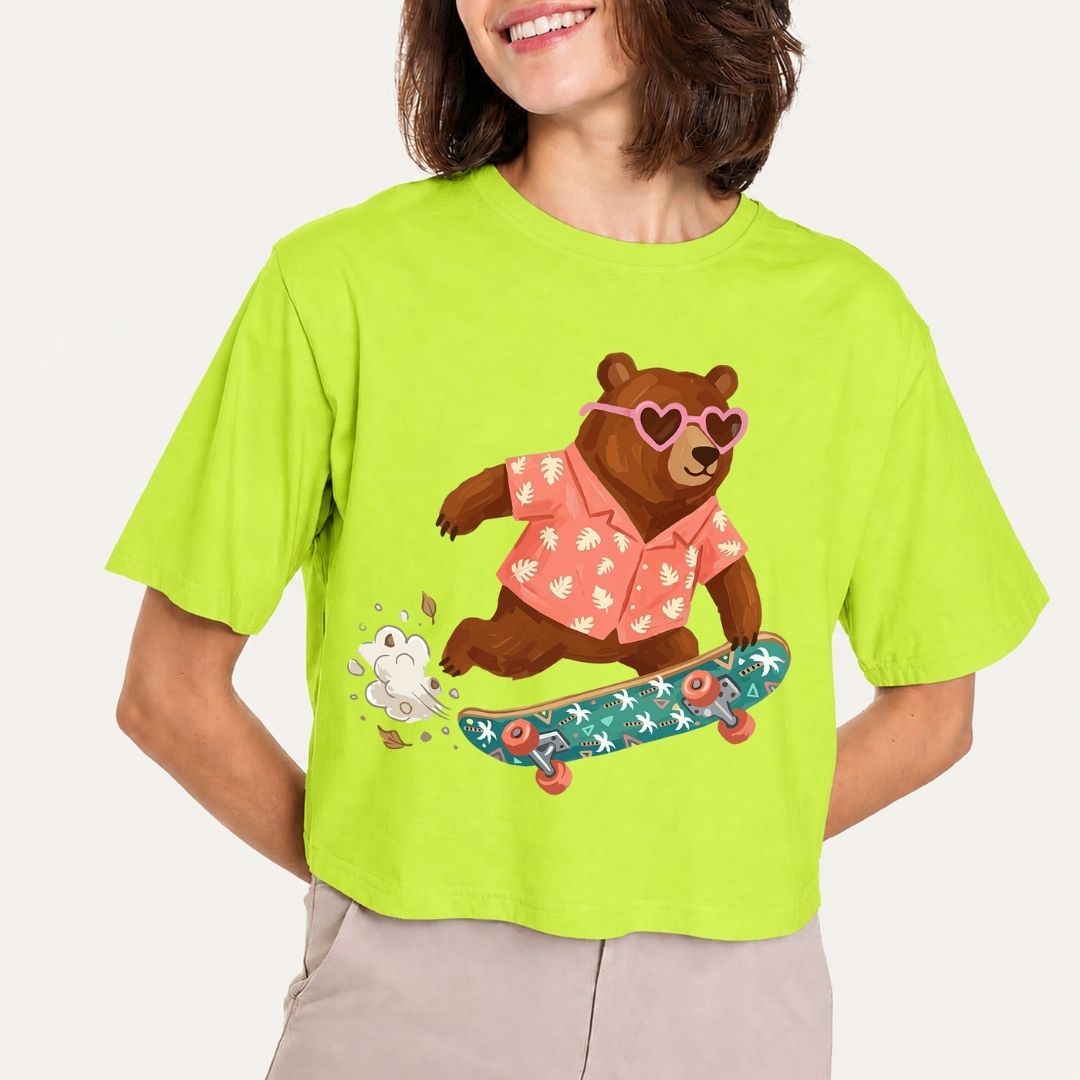 Person wearing a bright green t-shirt with a bear graphic on a plain background